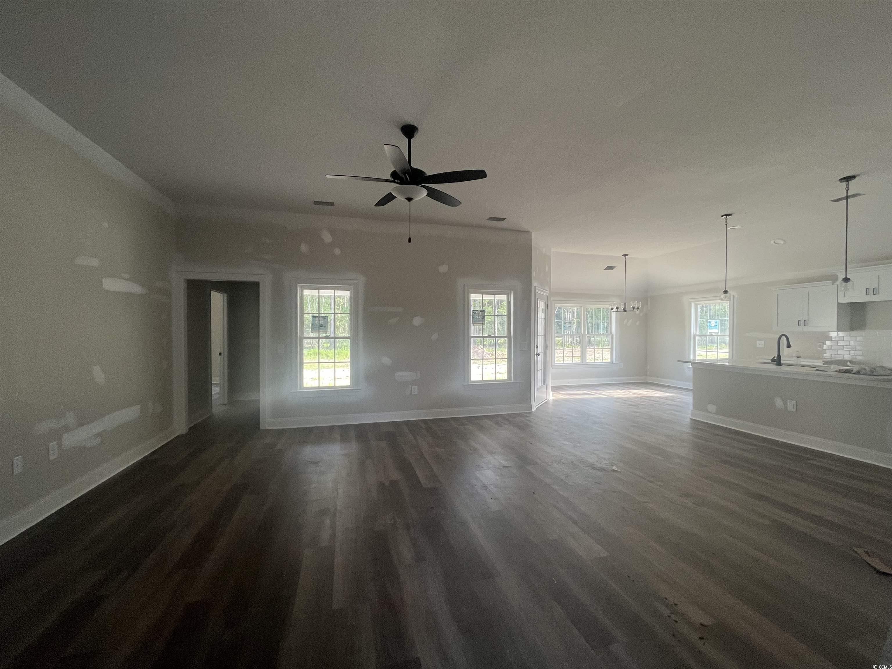 2921 Hughes Gasque Road Aynor, SC 29511 - Photo 2 of 14 Unfurnished living room featuring a ceiling fan, d