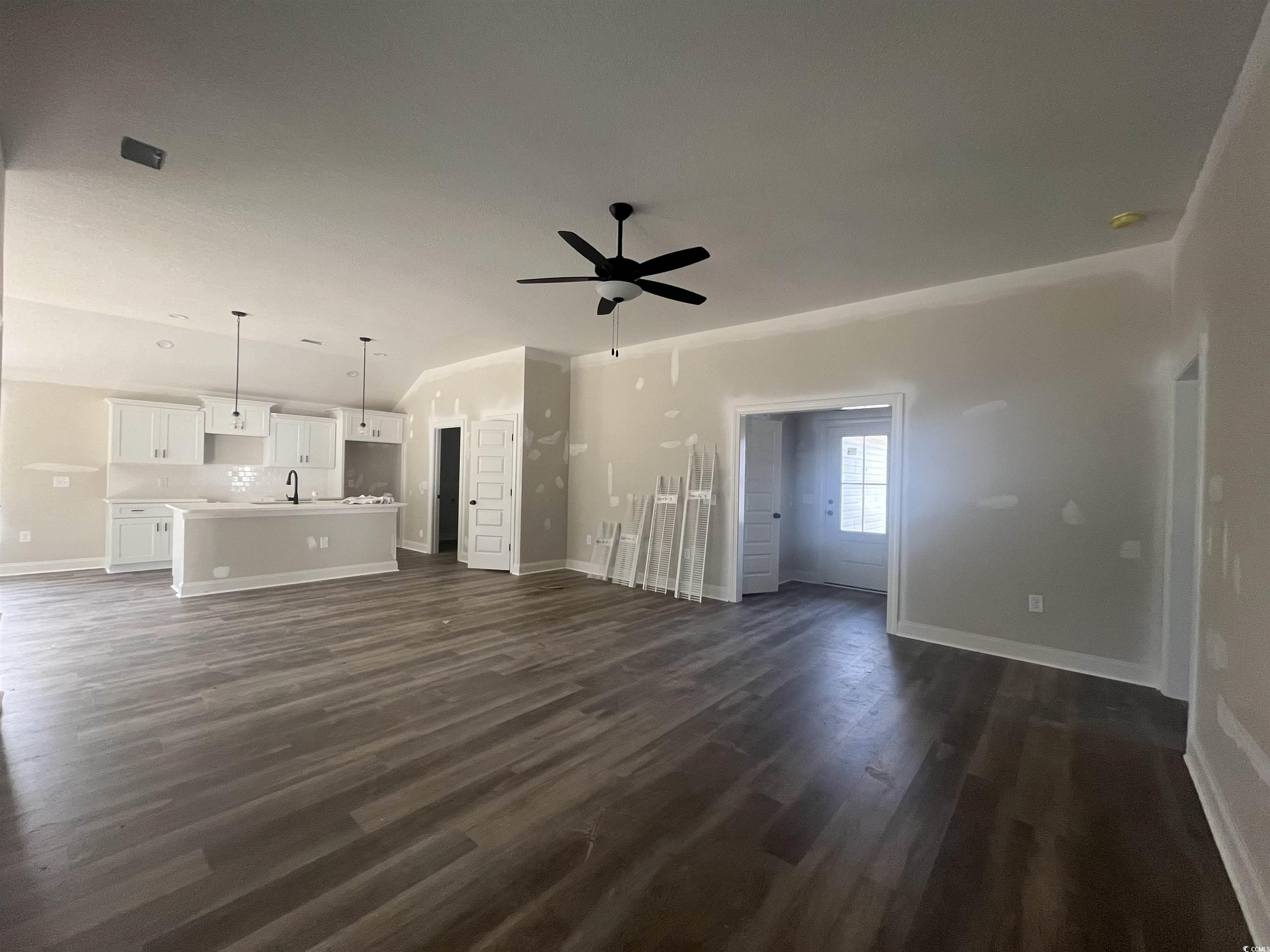 2921 Hughes Gasque Road Aynor, SC 29511 - Photo 3 of 14 Unfurnished living room featuring a ceiling fan an