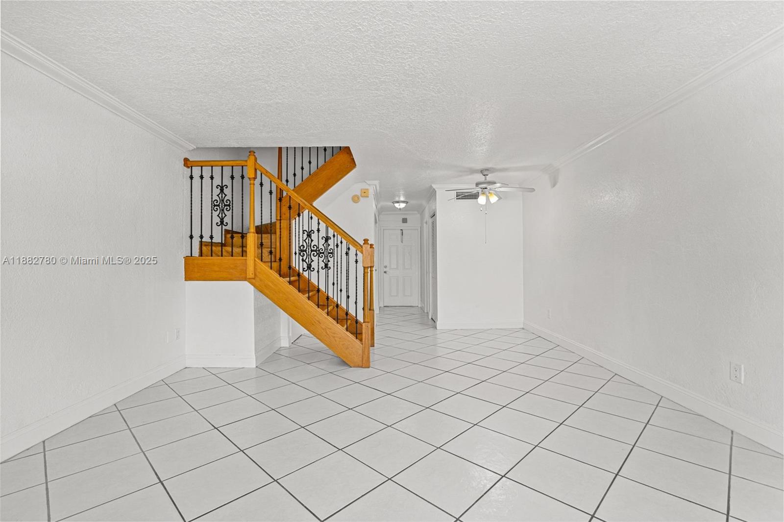 8650 Southwest 67th Avenue, Unit 1027 Pinecrest, FL 33156 - Photo 12 of 41 a view of an entryway with stairs