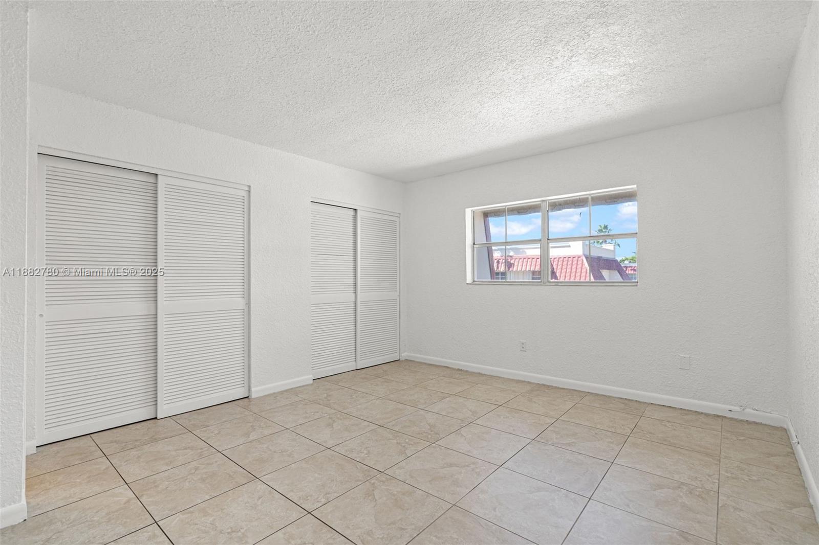 8650 Southwest 67th Avenue, Unit 1027 Pinecrest, FL 33156 - Photo 17 of 41 an empty room with windows