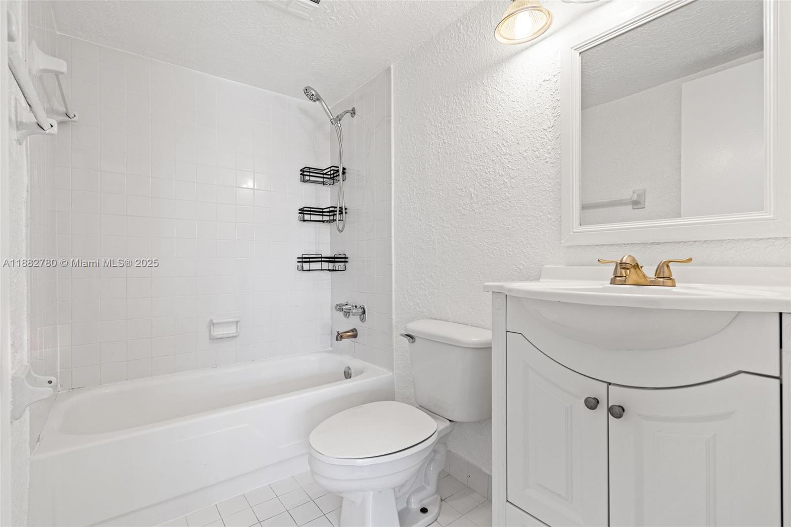 8650 Southwest 67th Avenue, Unit 1027 Pinecrest, FL 33156 - Photo 19 of 41 a bathroom with a sink toilet and shower