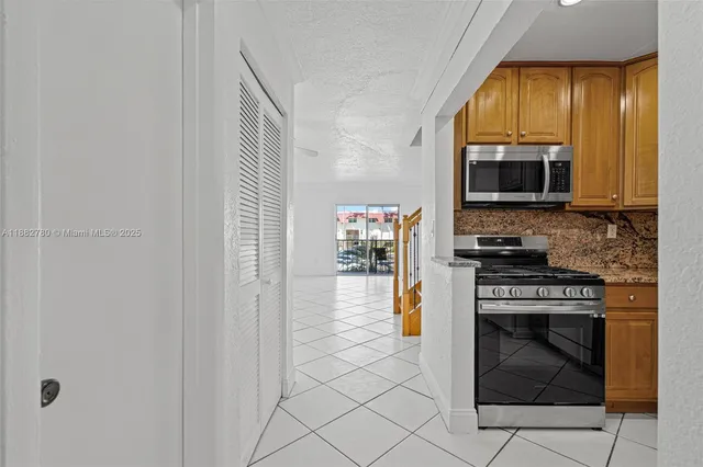 a kitchen with a stove and a microwave