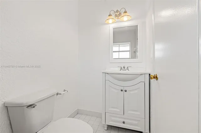 a bathroom with a granite countertop bathtub and sink