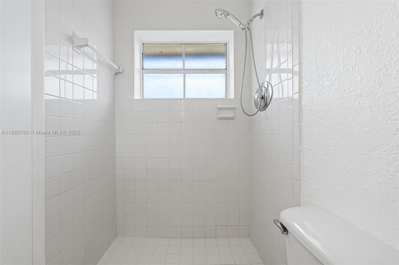 8650 Southwest 67th Avenue, Unit 1027 Pinecrest, FL 33156 - Photo 23 of 41 a bathroom with a granite countertop bathtub and sink