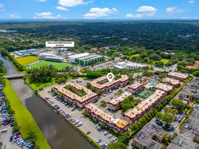 an aerial view of residential building and ocean