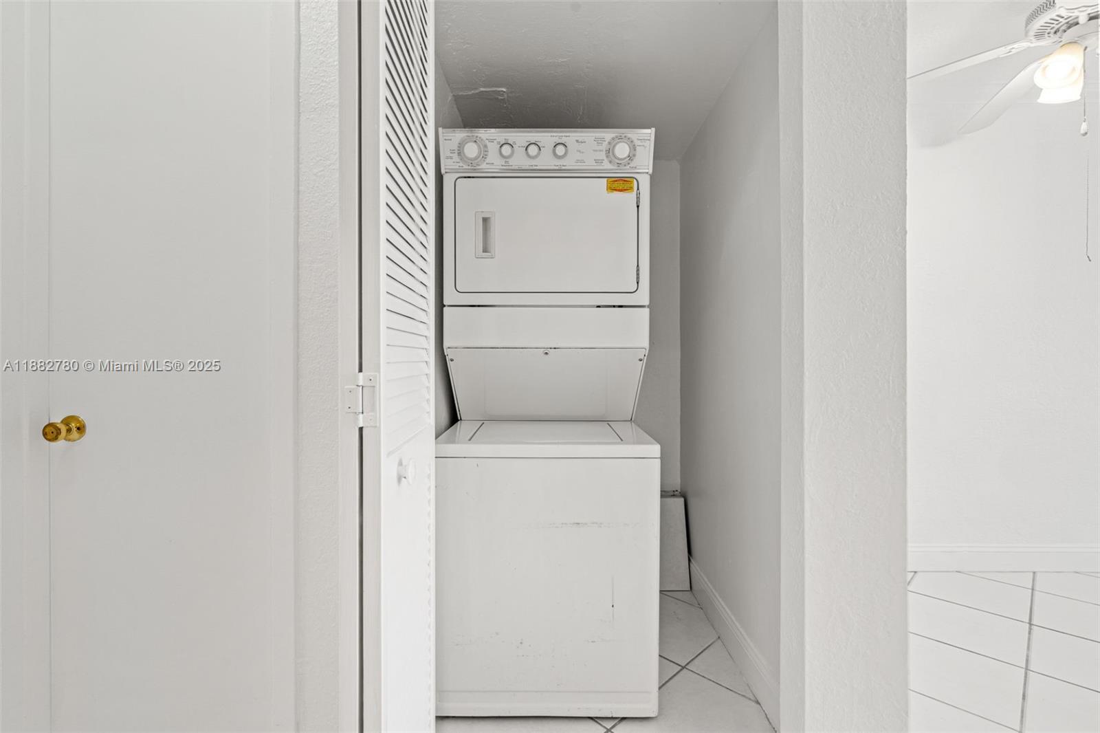 8650 Southwest 67th Avenue, Unit 1027 Pinecrest, FL 33156 - Photo 6 of 41 a utility room with dryer and washer