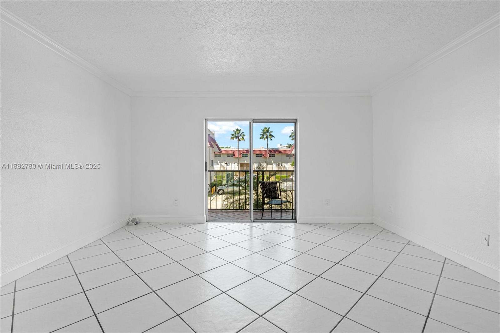 8650 Southwest 67th Avenue, Unit 1027 Pinecrest, FL 33156 - Photo 10 of 41 a view of an empty room with a window