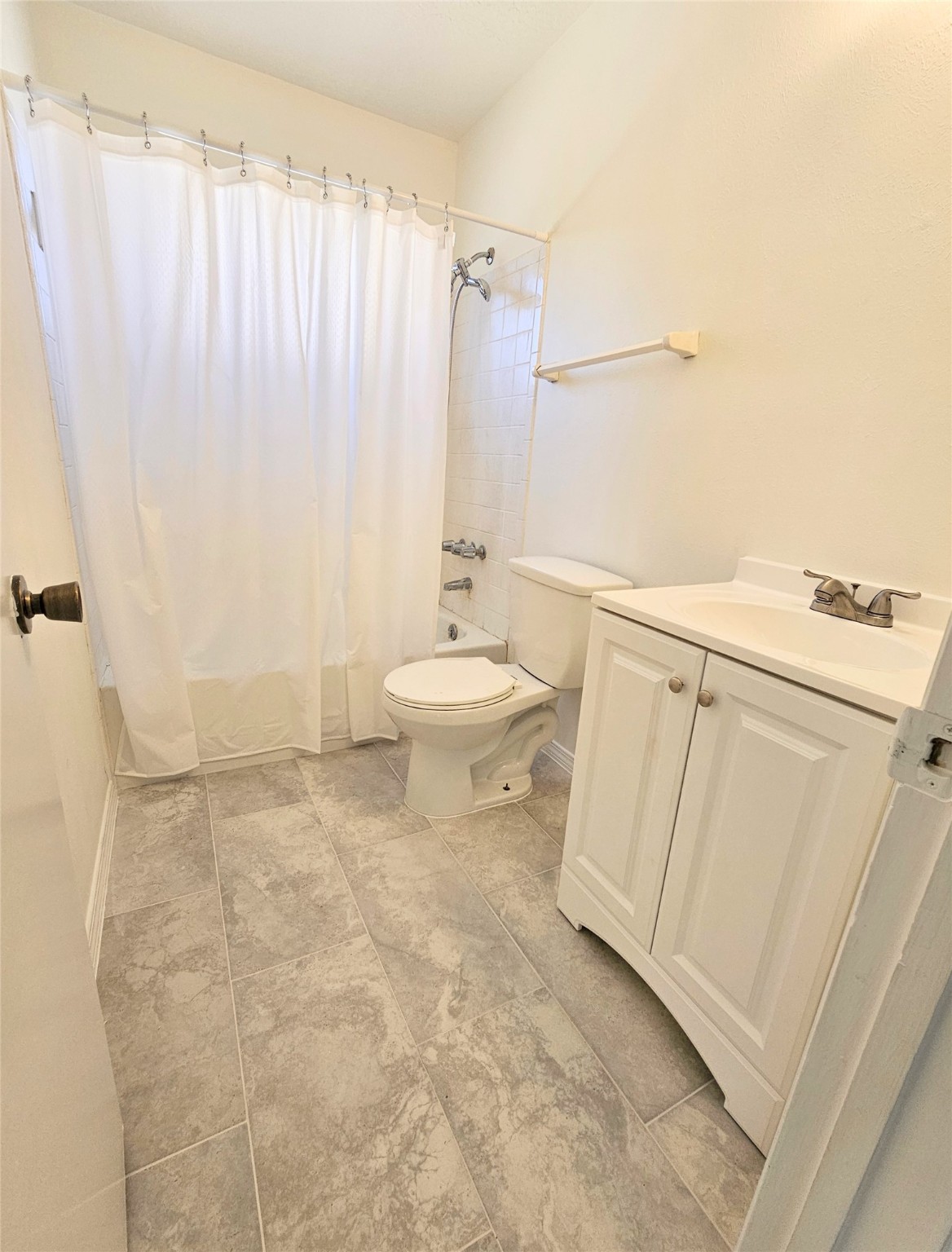 24022 Spring Briar Lane Spring, TX 77373 - Photo 20 of 34 a bathroom with a sink a toilet a mirror and shower curtain
