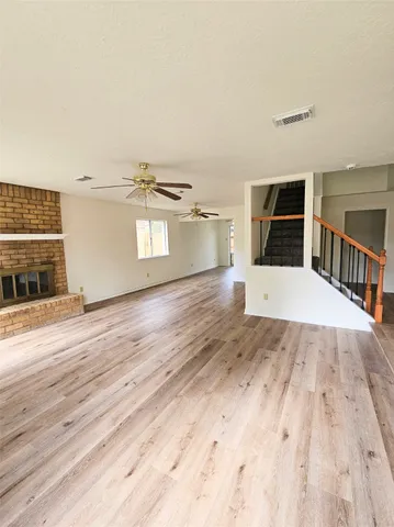 a bathroom with a sink a toilet a mirror and shower curtain