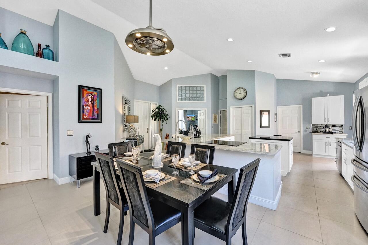 11067 Springbrook Circle Boynton Beach, FL 33437 - Photo 13 of 50 a view of a dining room with furniture