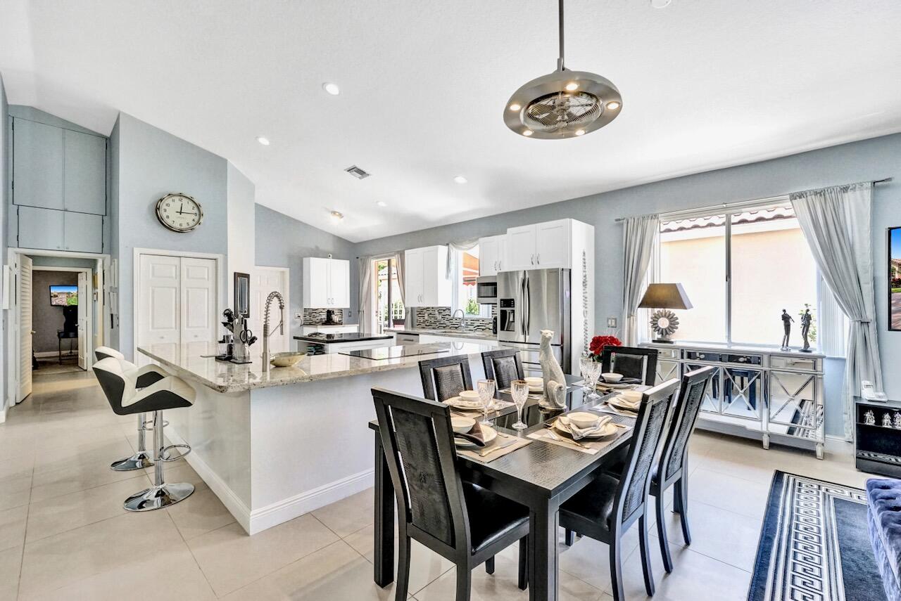 11067 Springbrook Circle Boynton Beach, FL 33437 - Photo 14 of 50 a view of a dining room with furniture window and outside view