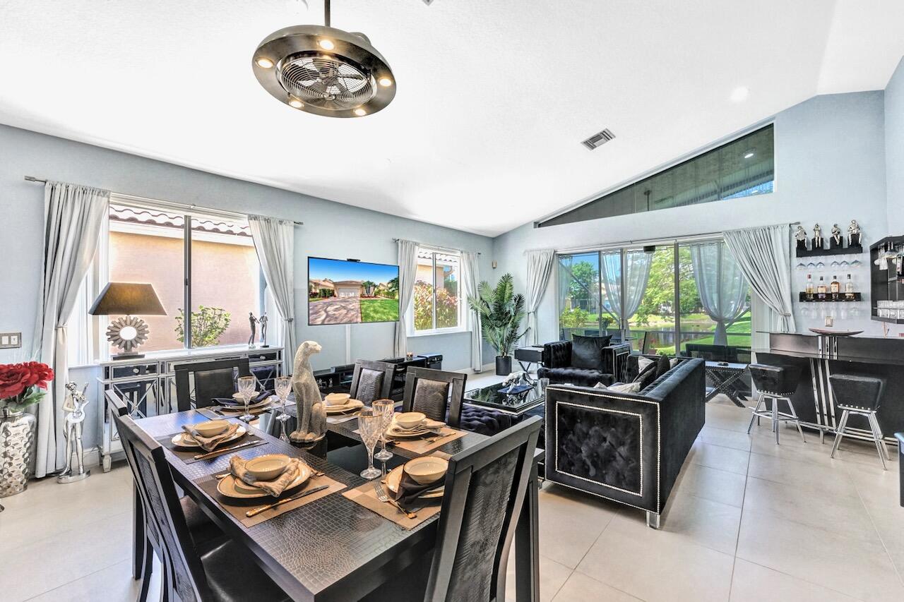 11067 Springbrook Circle Boynton Beach, FL 33437 - Photo 15 of 50 a view of a dining room with furniture window and outside view