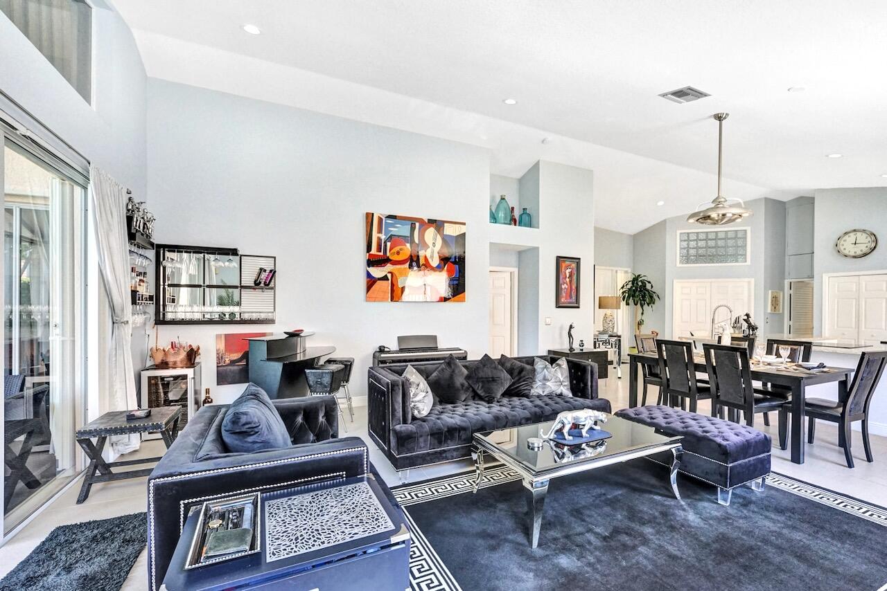 11067 Springbrook Circle Boynton Beach, FL 33437 - Photo 18 of 50 a living room with furniture a rug and a window