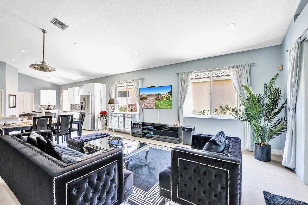 11067 Springbrook Circle Boynton Beach, FL 33437 - Photo 19 of 50 a living room with furniture and a potted plant