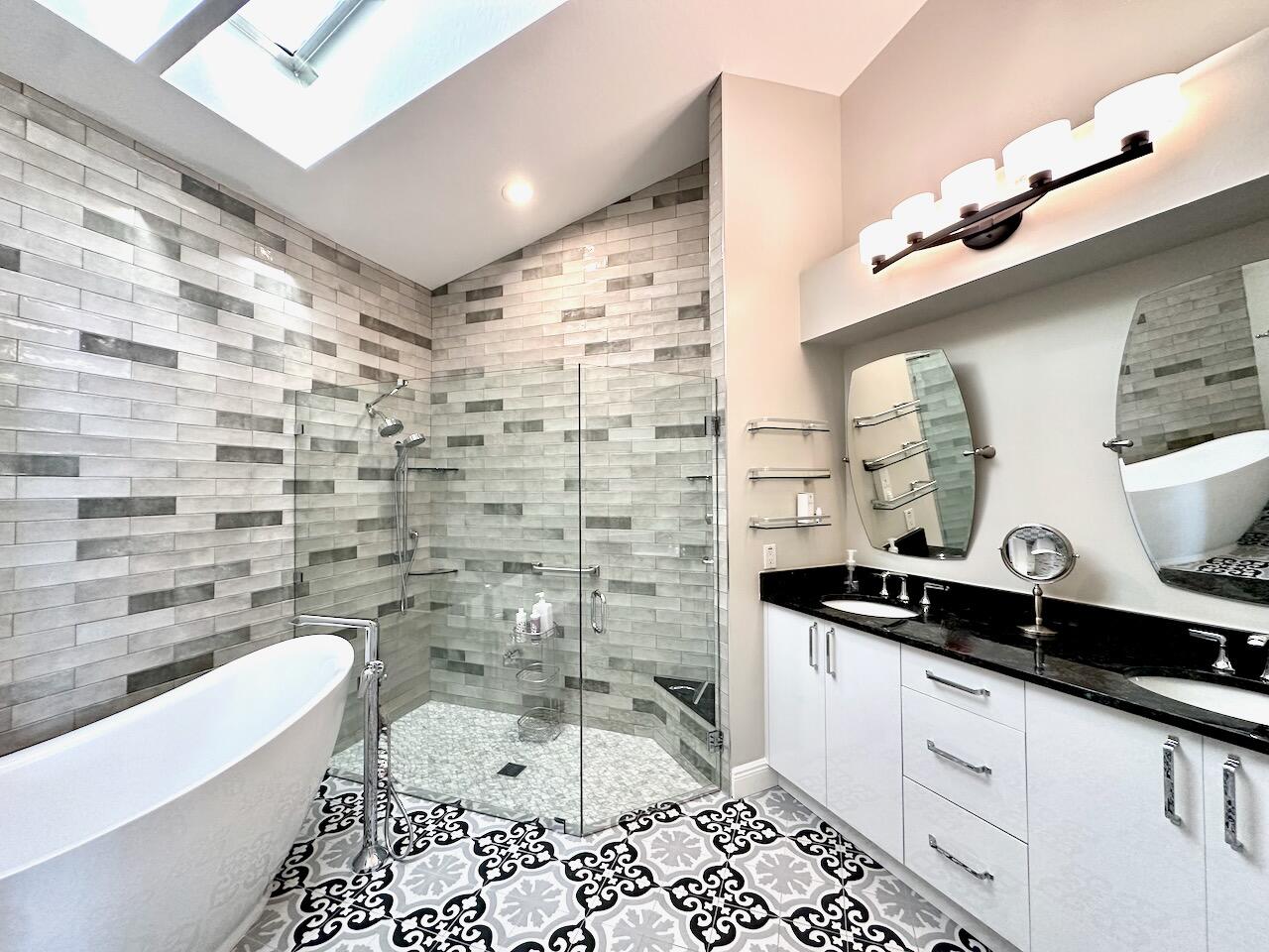 11067 Springbrook Circle Boynton Beach, FL 33437 - Photo 27 of 50 a bathroom with a bathtub and a sink