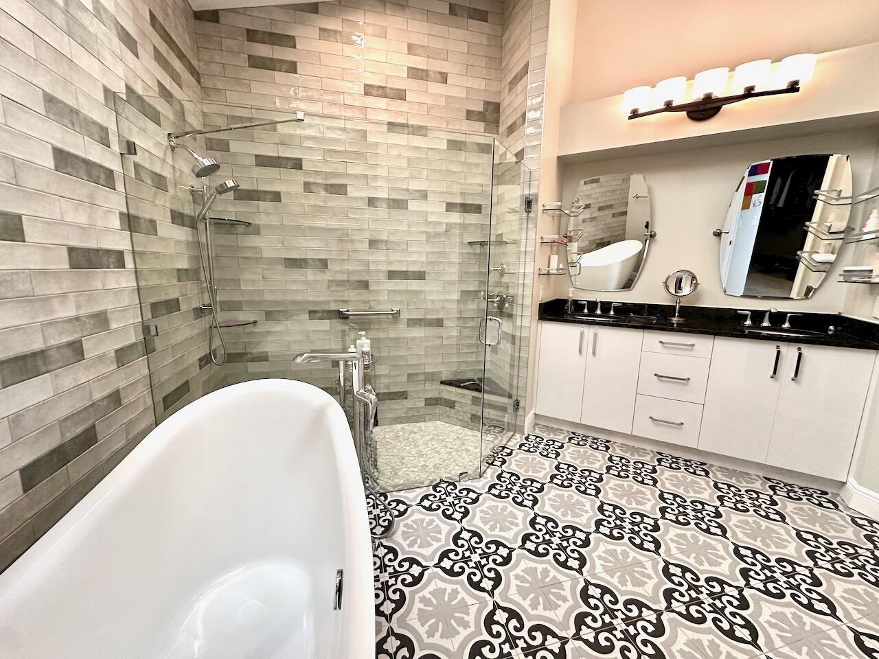 11067 Springbrook Circle Boynton Beach, FL 33437 - Photo 28 of 50 a bathroom with a bathtub and a sink