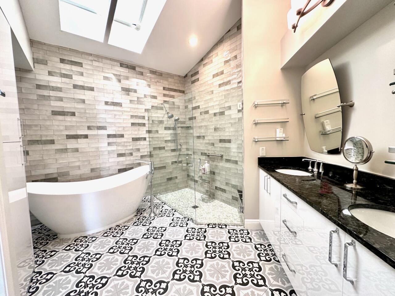 11067 Springbrook Circle Boynton Beach, FL 33437 - Photo 29 of 50 a bathroom with a granite countertop sink and a bathtub