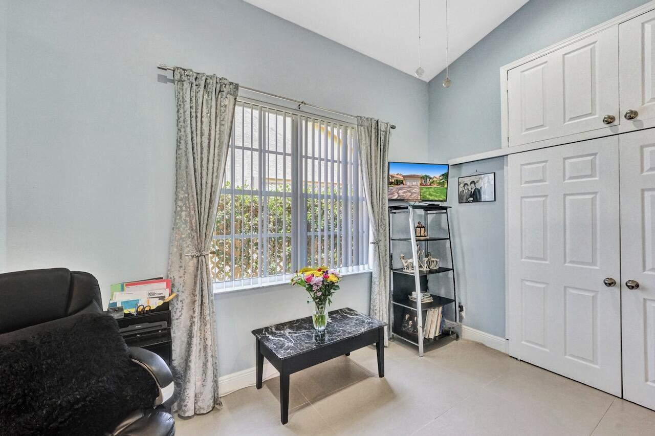 11067 Springbrook Circle Boynton Beach, FL 33437 - Photo 35 of 50 a living room with furniture and a window