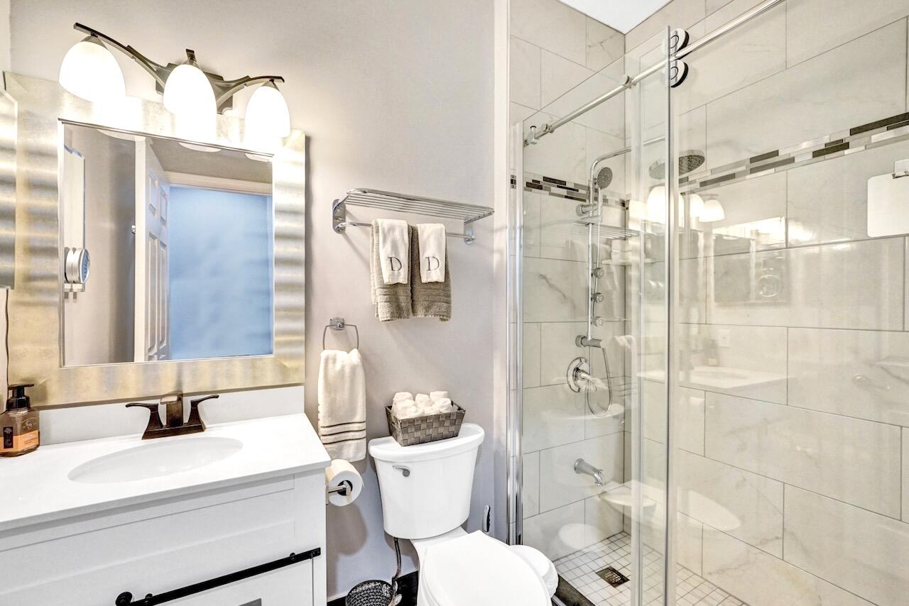 11067 Springbrook Circle Boynton Beach, FL 33437 - Photo 37 of 50 a bathroom with a sink toilet and shower