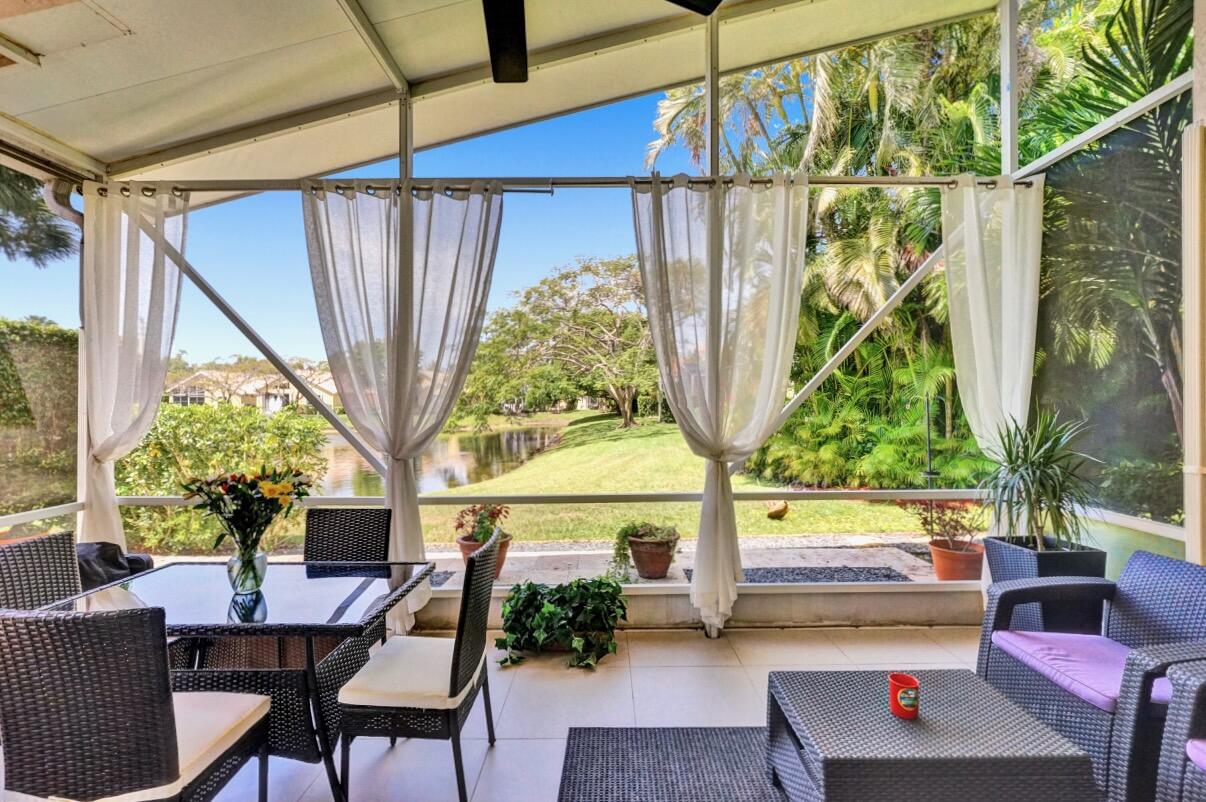 11067 Springbrook Circle Boynton Beach, FL 33437 - Photo 39 of 50 a living room with furniture and a window