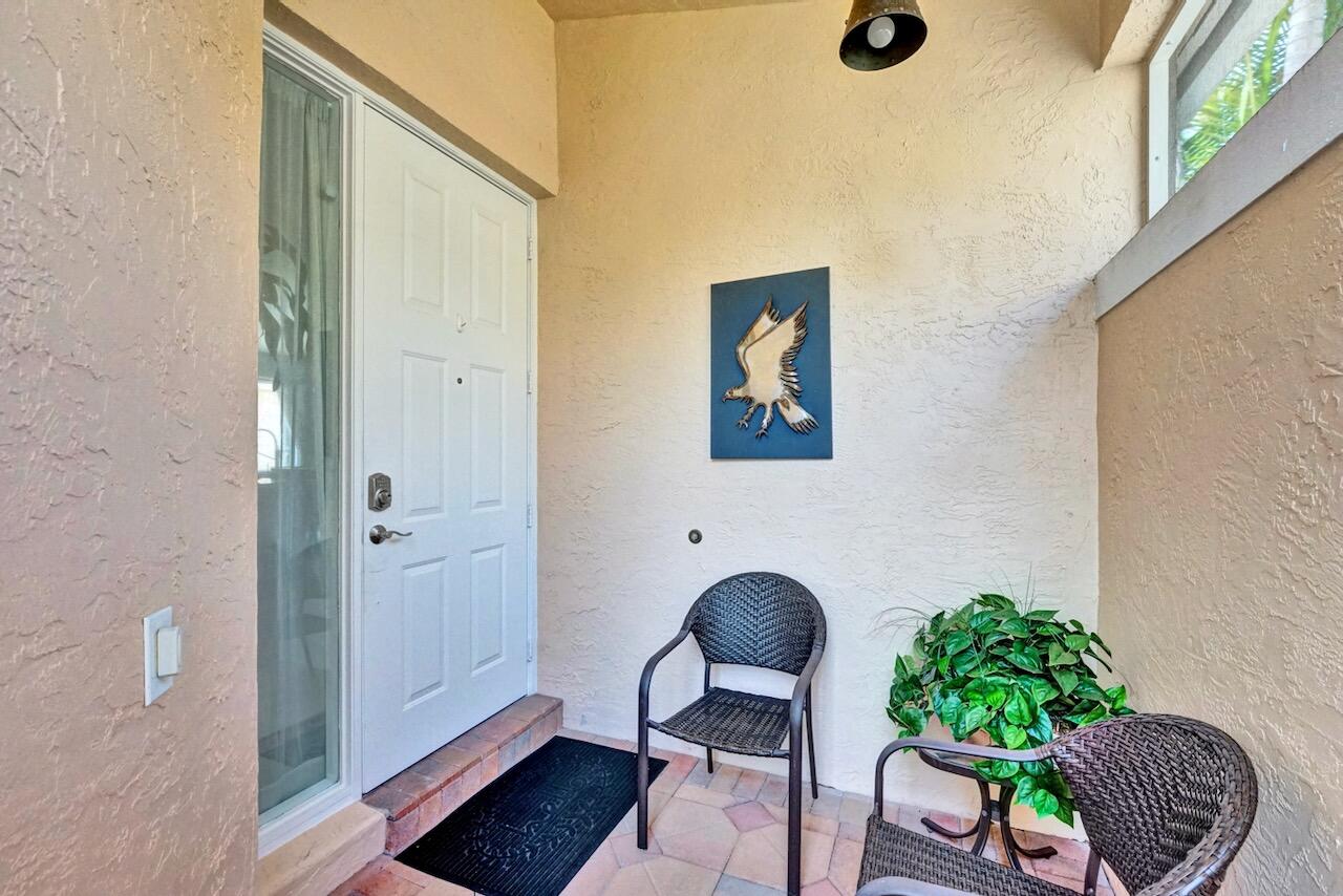 11067 Springbrook Circle Boynton Beach, FL 33437 - Photo 4 of 50 a living room with furniture and a potted plant