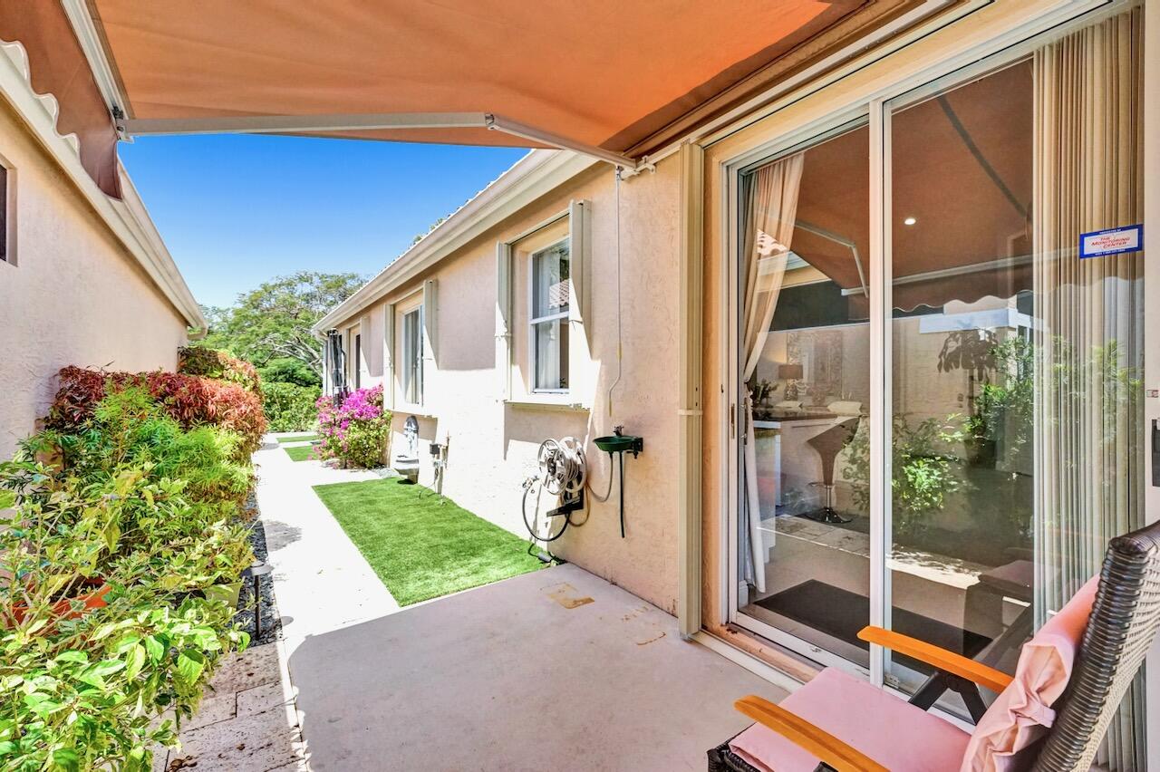 11067 Springbrook Circle Boynton Beach, FL 33437 - Photo 46 of 50 a view of a backyard with a patio