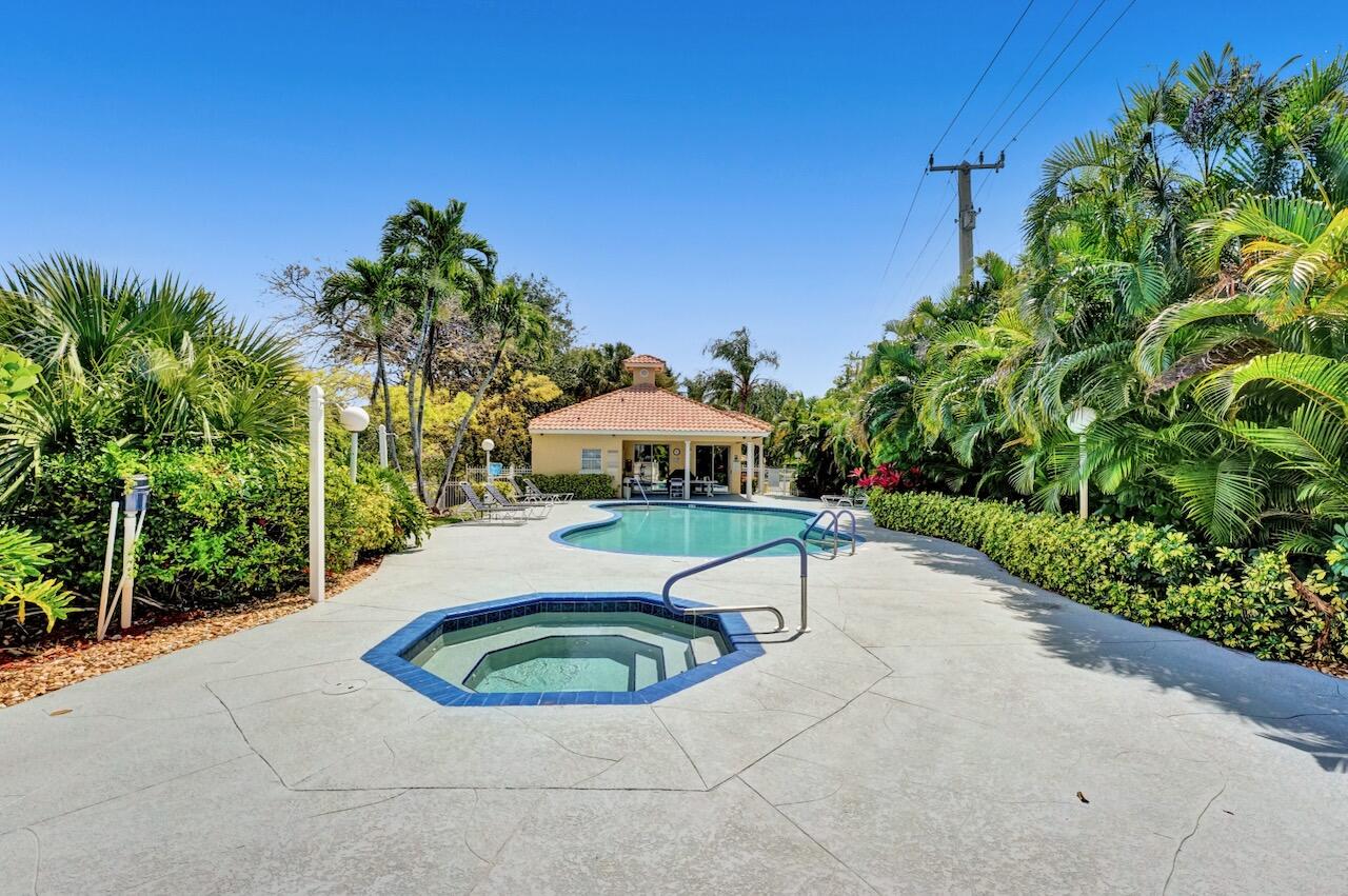 11067 Springbrook Circle Boynton Beach, FL 33437 - Photo 50 of 50 a view of a swimming pool with a patio