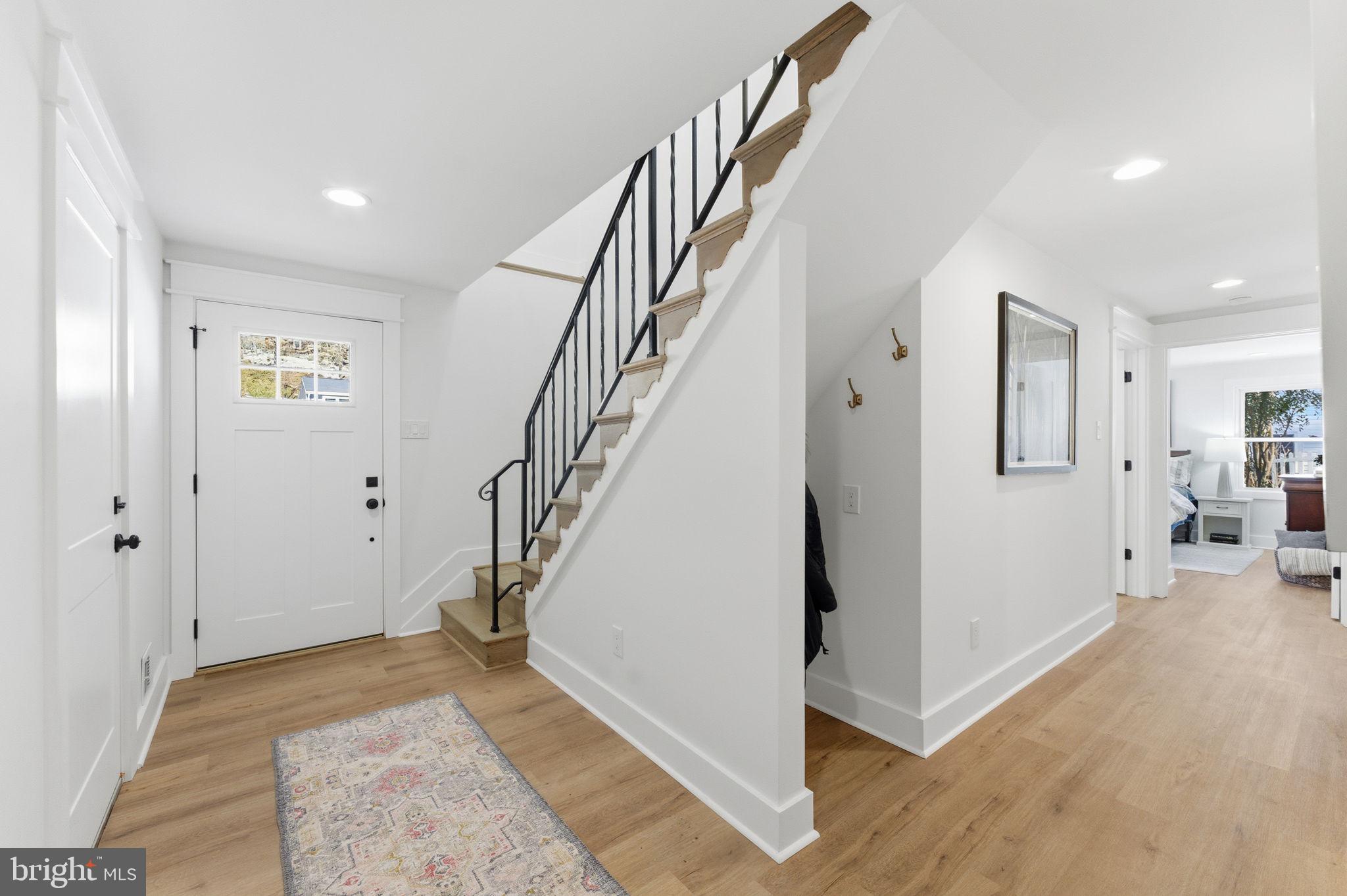 8615 Kerry Lane Springfield, VA 22152 - Photo 27 of 50 a view of a hallway with wooden floor and entryway