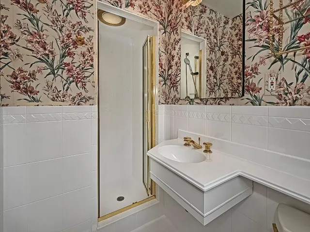 a bathroom with a sink and mirror