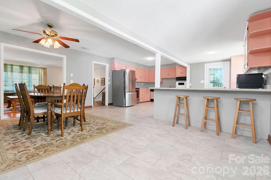 1482 Island Ford Road Brevard, NC 28712 - Photo 11 of 48 a dining room filled counter top space and a kitchen view