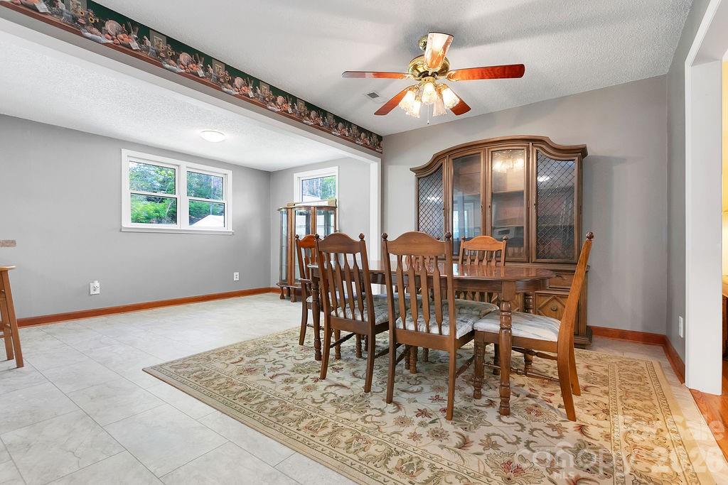 1482 Island Ford Road Brevard, NC 28712 - Photo 18 of 48 a view of a dining room with furniture