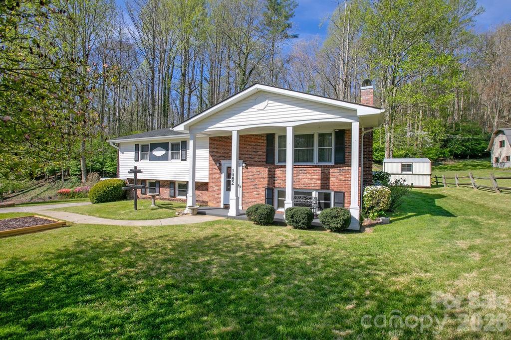 1482 Island Ford Road Brevard, NC 28712 - Photo 2 of 48 a front view of a house with a yard and trees