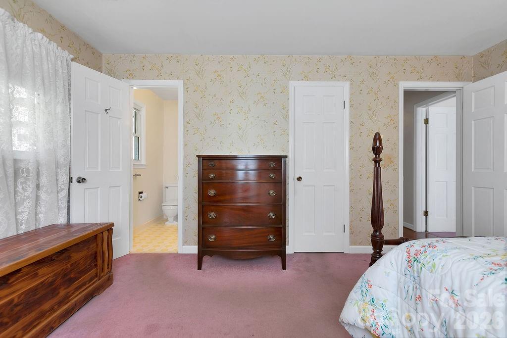 1482 Island Ford Road Brevard, NC 28712 - Photo 22 of 48 a bedroom with a bed and a dresser