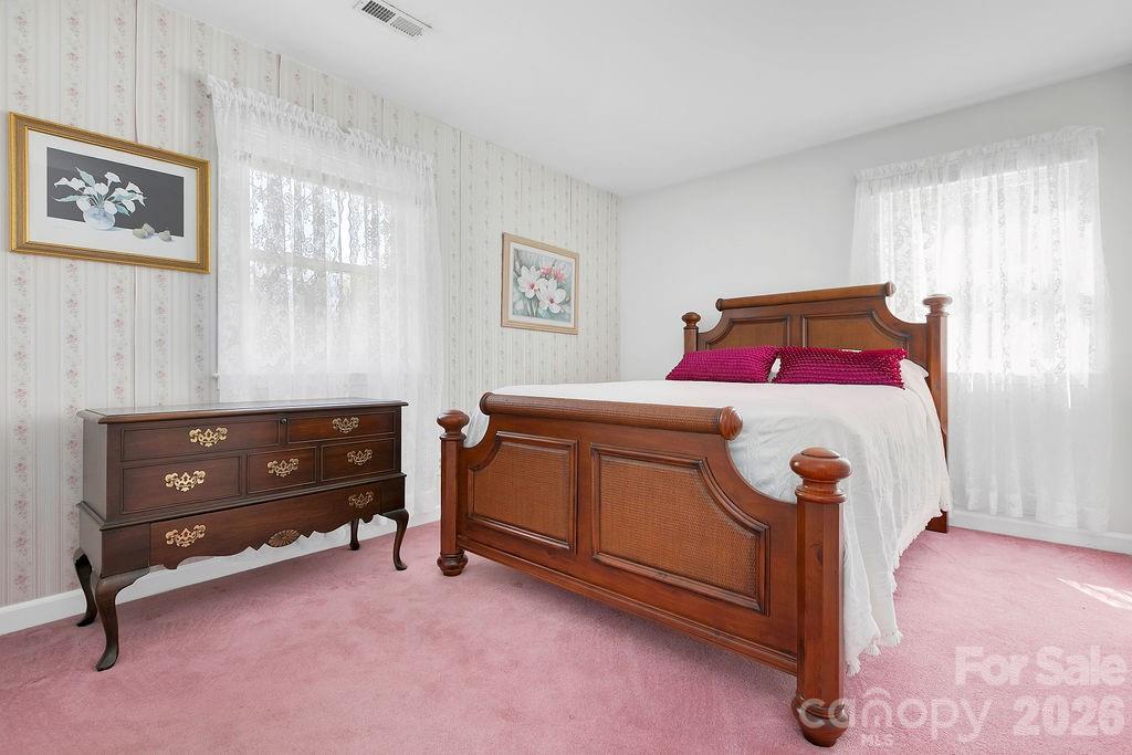 1482 Island Ford Road Brevard, NC 28712 - Photo 24 of 48 a bedroom with a bed and a dresser