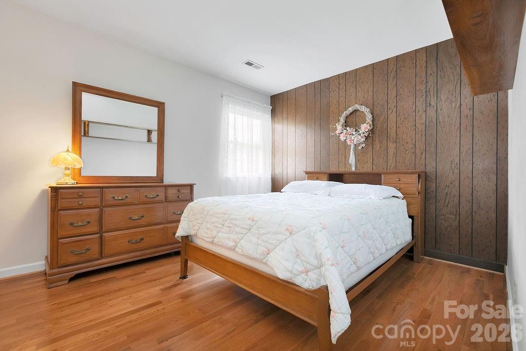 1482 Island Ford Road Brevard, NC 28712 - Photo 26 of 48 a bedroom with a bed and a dresser