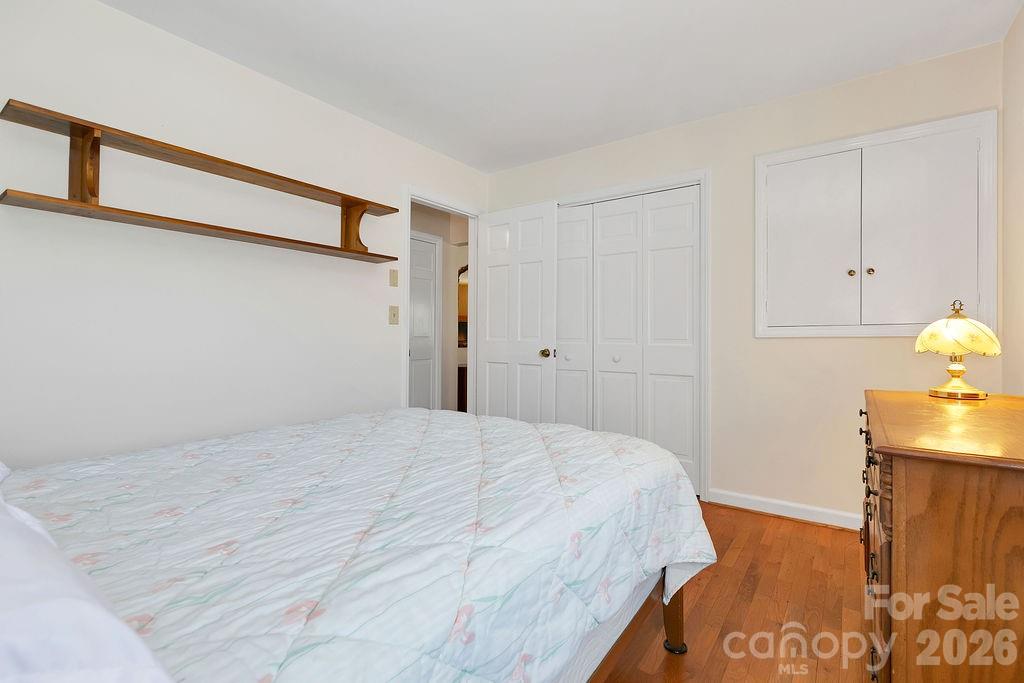 1482 Island Ford Road Brevard, NC 28712 - Photo 27 of 48 a bedroom with a bed and a dresser