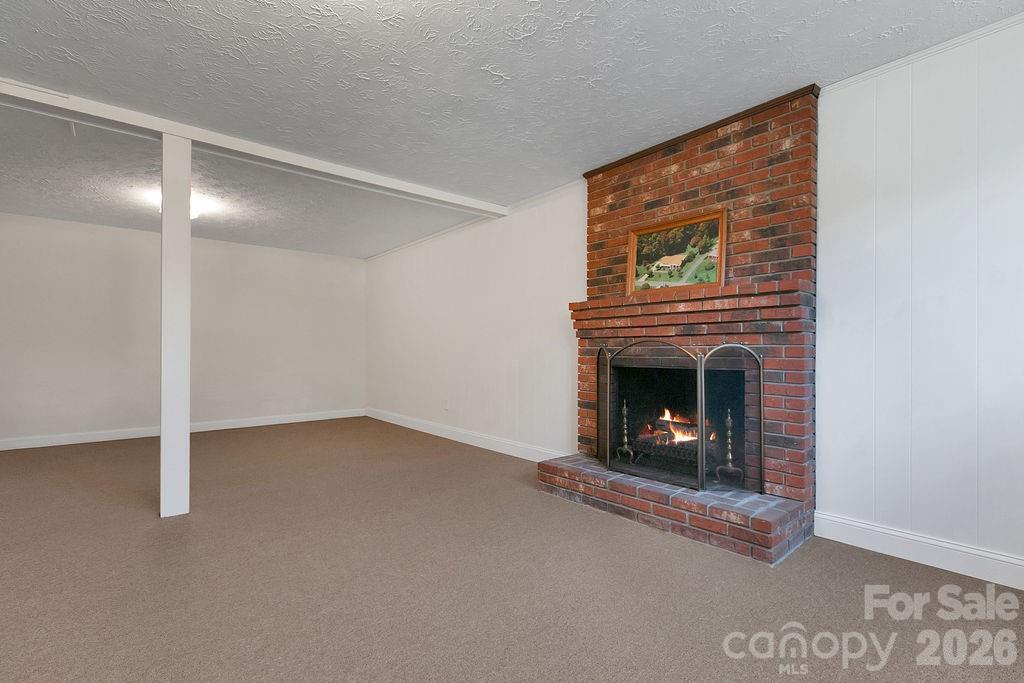 1482 Island Ford Road Brevard, NC 28712 - Photo 29 of 48 a living room with a fireplace