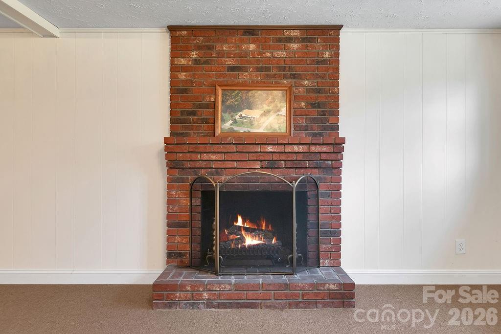 1482 Island Ford Road Brevard, NC 28712 - Photo 32 of 48 a living room with a fireplace