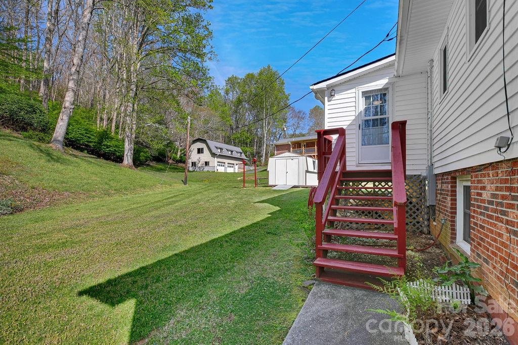 1482 Island Ford Road Brevard, NC 28712 - Photo 36 of 48 a backyard of a house with lots of green space