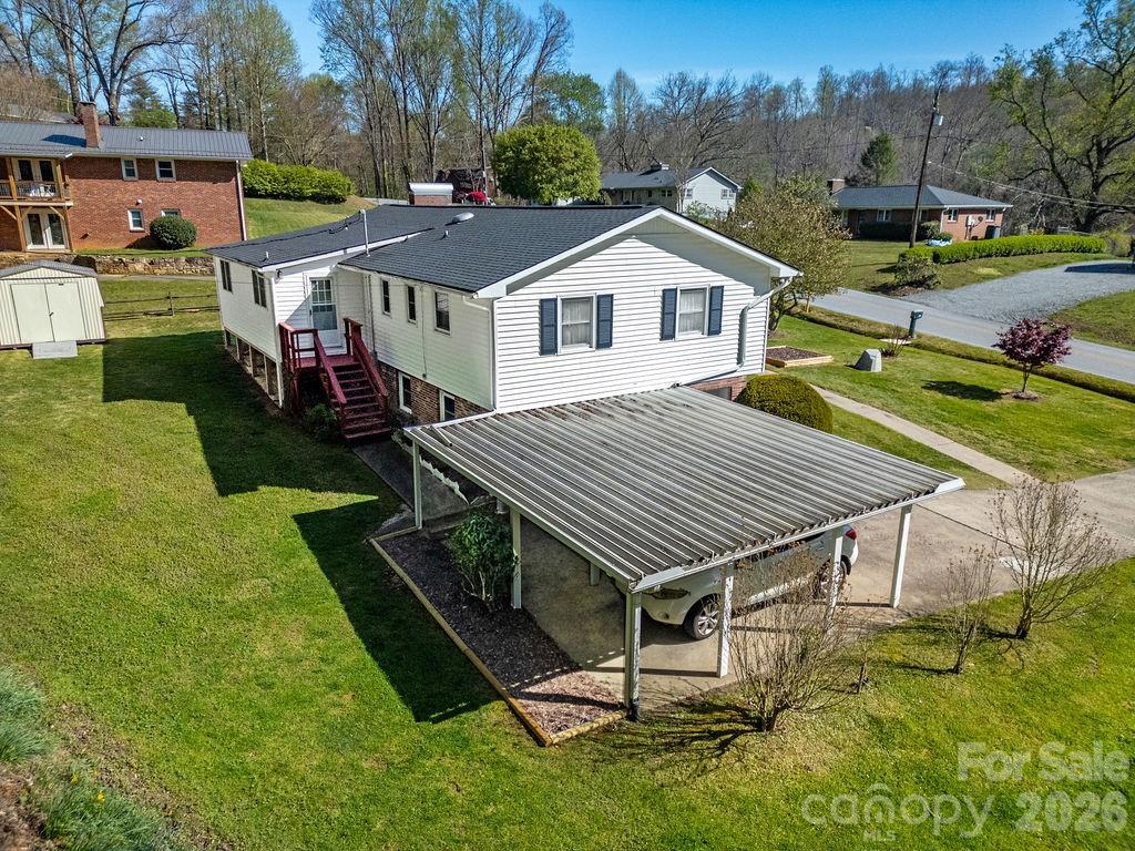1482 Island Ford Road Brevard, NC 28712 - Photo 38 of 48 a aerial view of a house with a yard table and chairs
