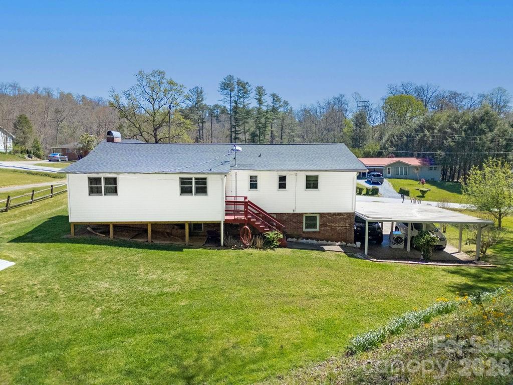 1482 Island Ford Road Brevard, NC 28712 - Photo 39 of 48 a view of a house with a big yard and sitting area