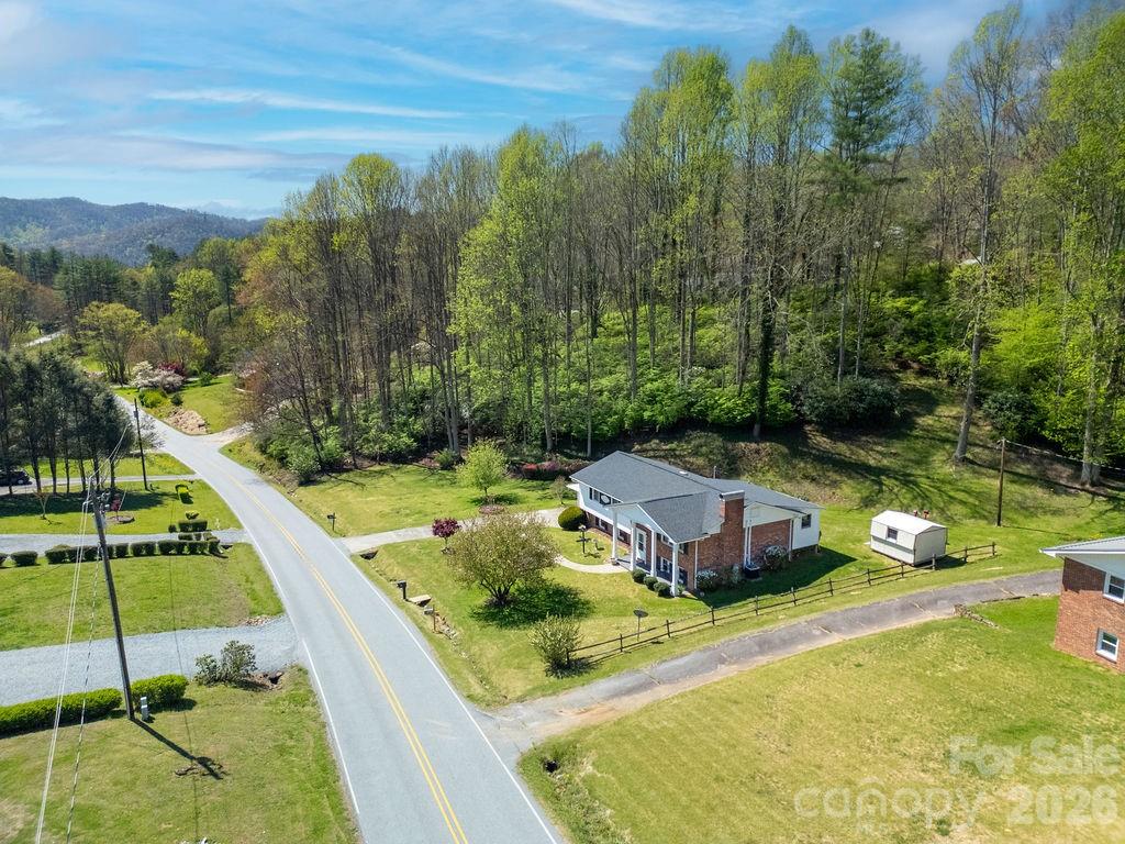 1482 Island Ford Road Brevard, NC 28712 - Photo 42 of 48 a view of a swimming pool with a garden and trees