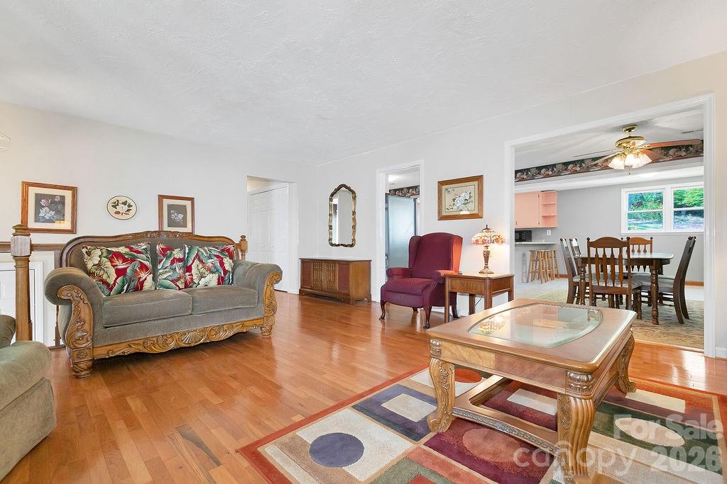 1482 Island Ford Road Brevard, NC 28712 - Photo 10 of 48 a living room with furniture and wooden floor