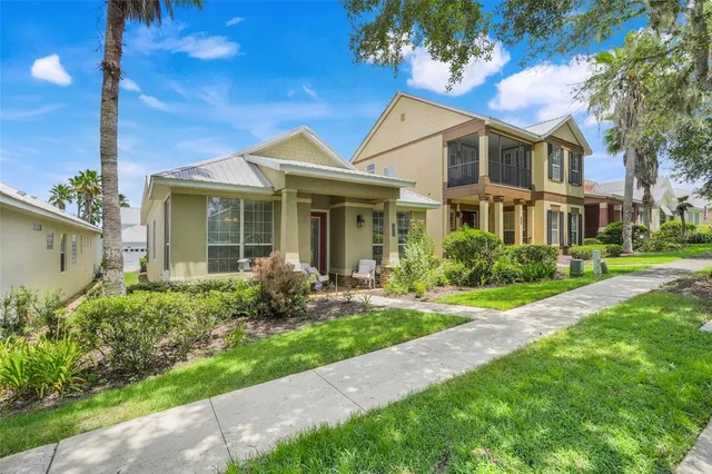 a front view of a house with garden and porch