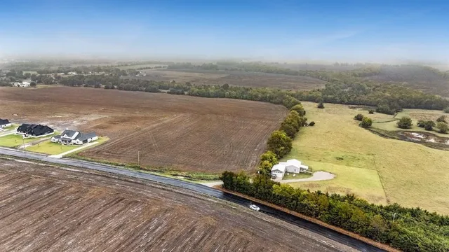 a view of a backyard of a house