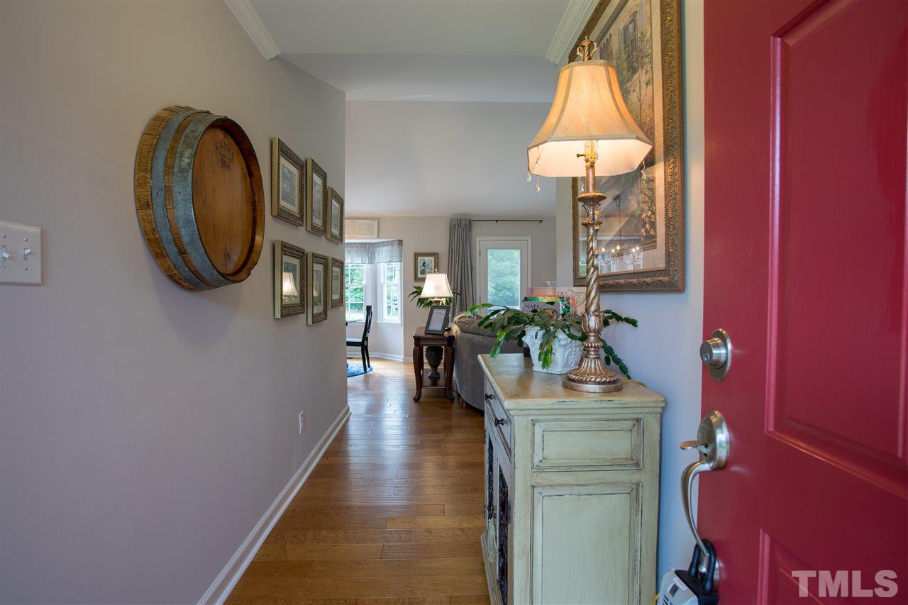 4017 Forty-Niner's Road Clayton, NC 27520 - Photo 2 of 25 Inviting Foyer with Engineered Hardwoods Extending Throughout