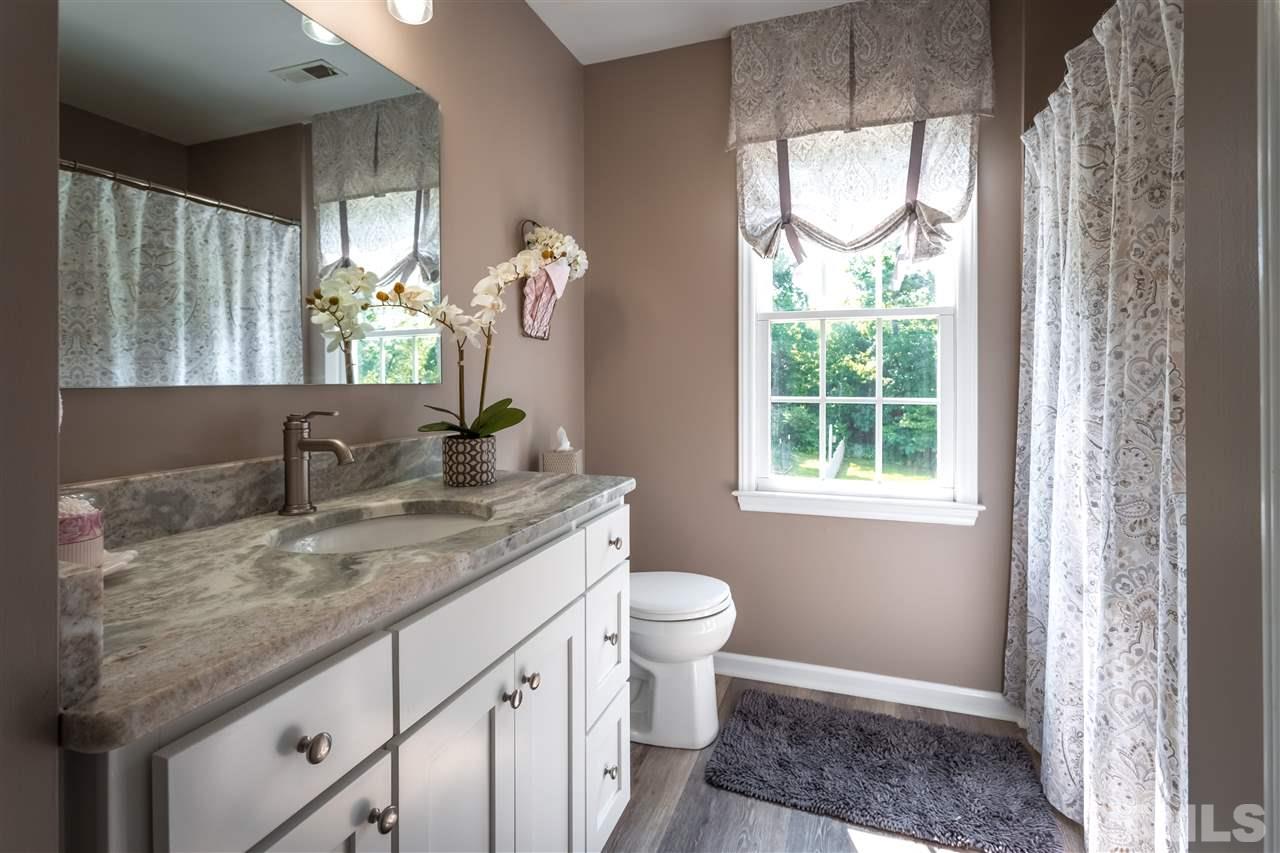4017 Forty-Niner's Road Clayton, NC 27520 - Photo 18 of 25 Upstairs Full Bathroom Adjacent to Bonus Room