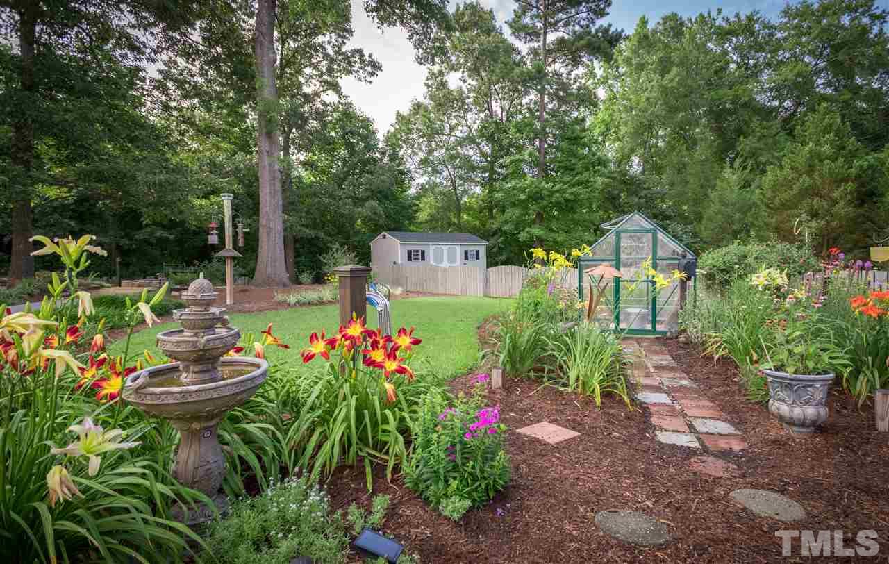 4017 Forty-Niner's Road Clayton, NC 27520 - Photo 20 of 25 Enjoy Lovely Perennial Garden with Small Greenhouse