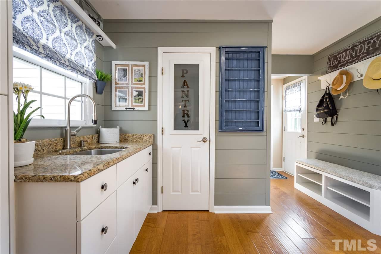 4017 Forty-Niner's Road Clayton, NC 27520 - Photo 8 of 25 Walk-in Pantry with Custom Door in Mudd Room