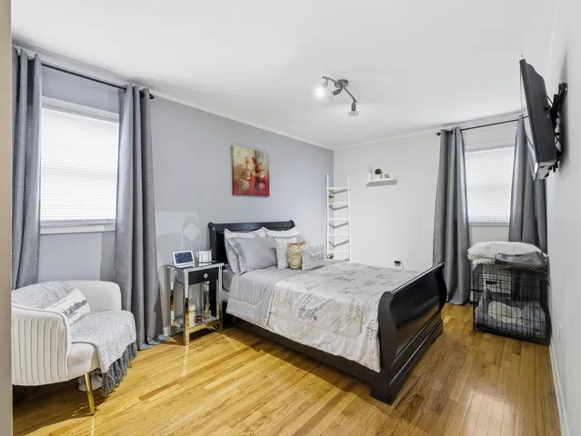 a spacious bedroom with a bed and a couch